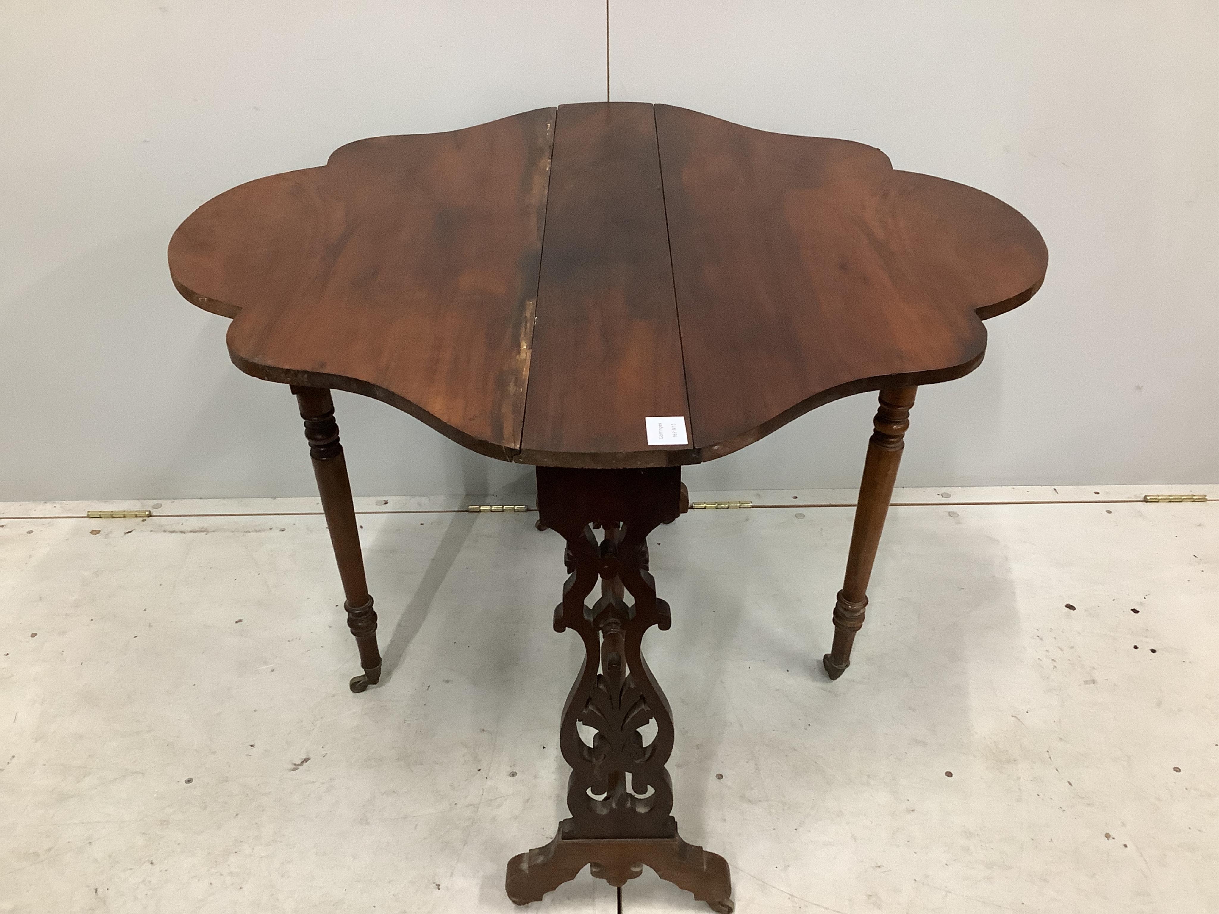 A Victorian walnut Sutherland table with shaped oval top, width 88cm, depth 16cm, height 72cm. Condition - fair